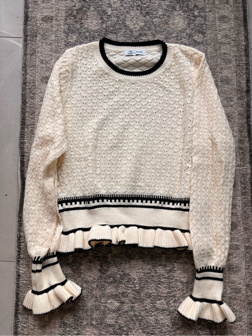 Cupshe Cream Knit Ruffle-Hem Sweater with Black Trim
